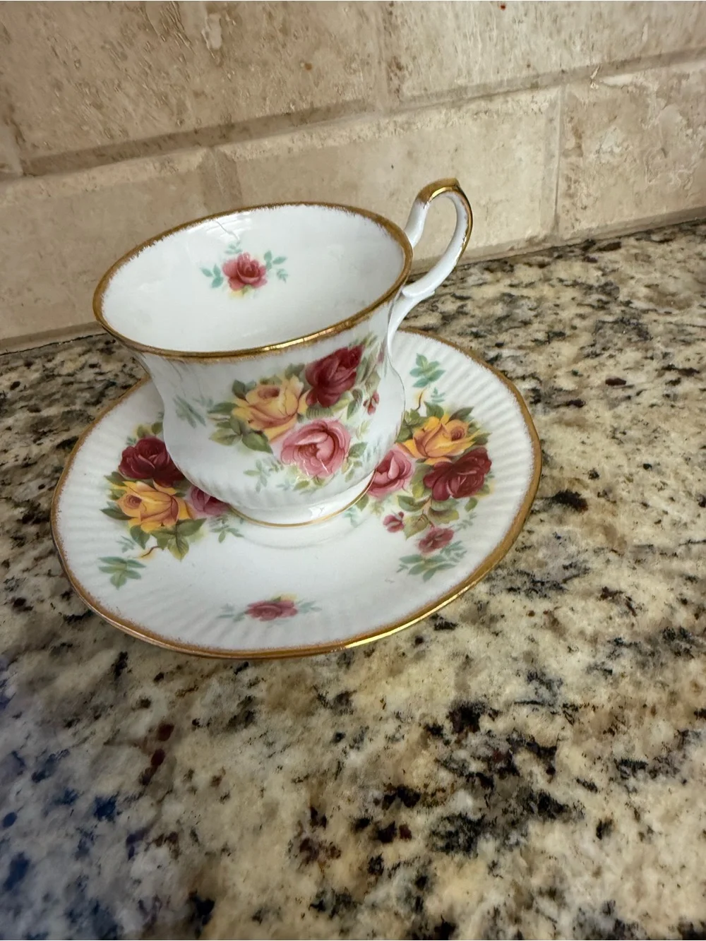 Porcelain Teacup and Saucer Set with Pink and Yellow Rose Pattern